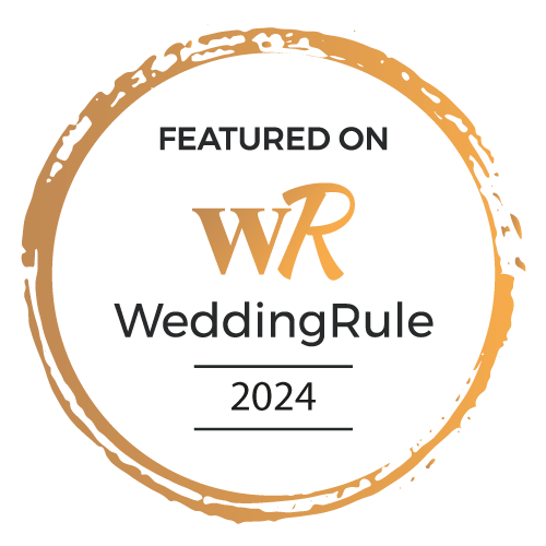 Featured on WeddingRule 2024" badge with golden circular border and white background.