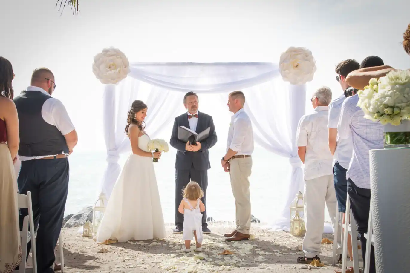 A beach wedding ceremony in Key West with a bride and groom, captured beautifully by a Key West wedding photographer.
