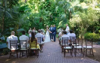 A tropical garden wedding ceremony in Key West, featuring a skilled wedding officiant.