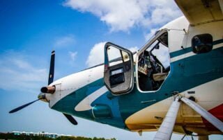 A small airplane with propellers on the tarmac at Key West Airport